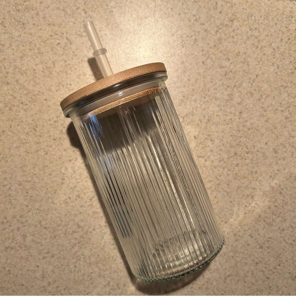Glass cup with bamboo lid. Never used, brand new.